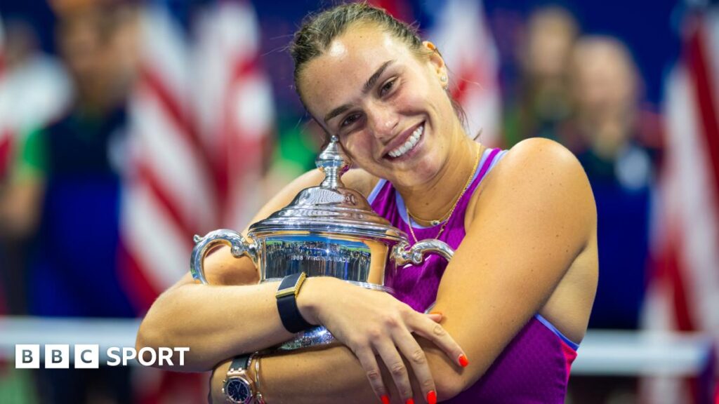 Aryna Sabalenka hugs the US Open trophy after her victory in 2024
