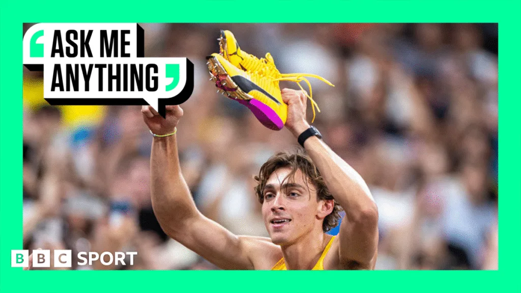 Armand Duplantis holds up his claw shoes