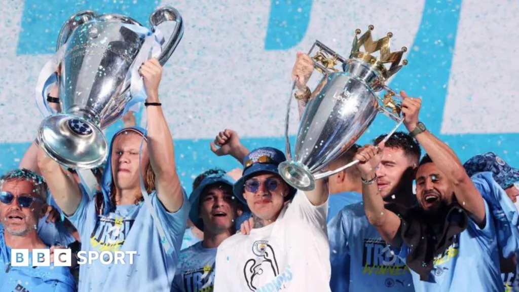 Erling Haaland lifts the Champions League trophy as Ederson and Riyad Mahrez hold the Premier League trophy for Manchester City in 2022-23