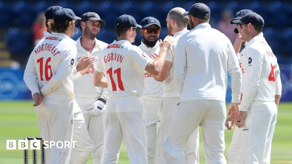 Glamorgan players celebrate taking a wicket