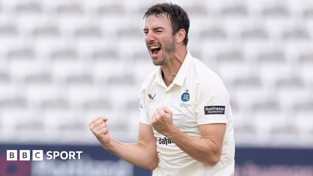 Toby Roland-Jones takes a wicket for Middlesex
