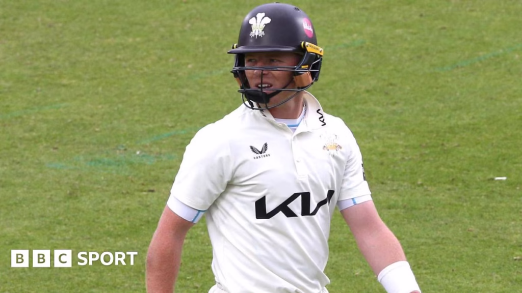 Ollie Pope walks off the field
