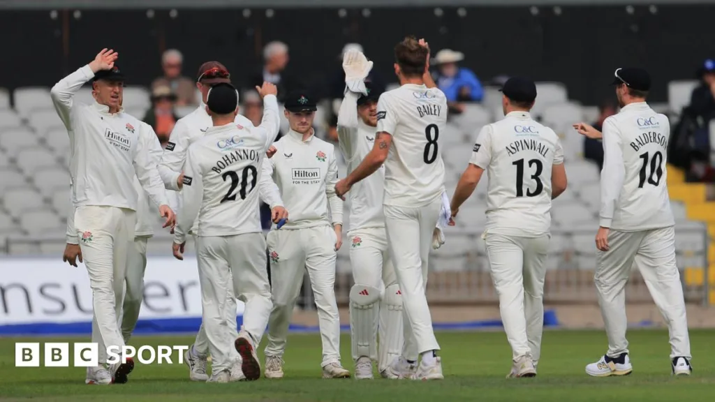 Lancashire players gather round Tom Bailey to celebrate his first of four Middlesex wickets
