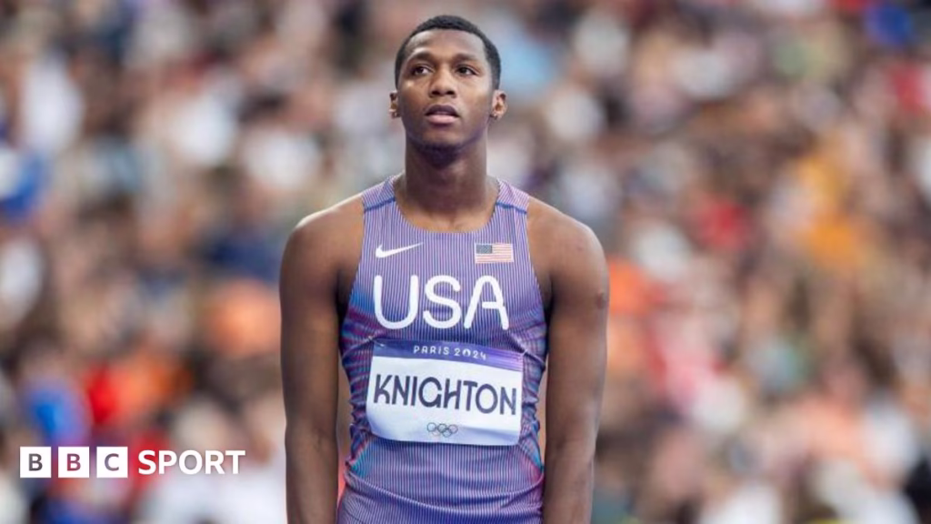 Erriyon Knighton wearing a purple vest