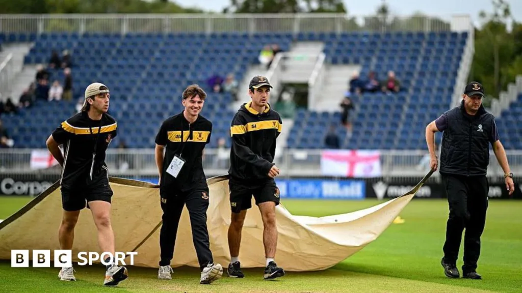 Staff move covers before at Malahide before T20 between Ireland and England was abandoned