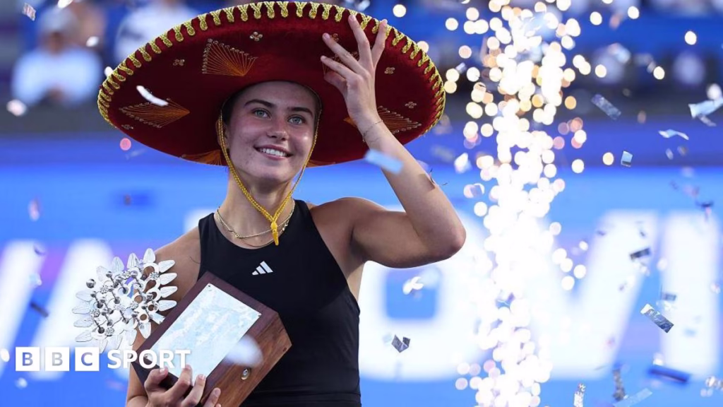 Iva Jovic wears sombrero and holds a trophy after winning the Guadalajara Open