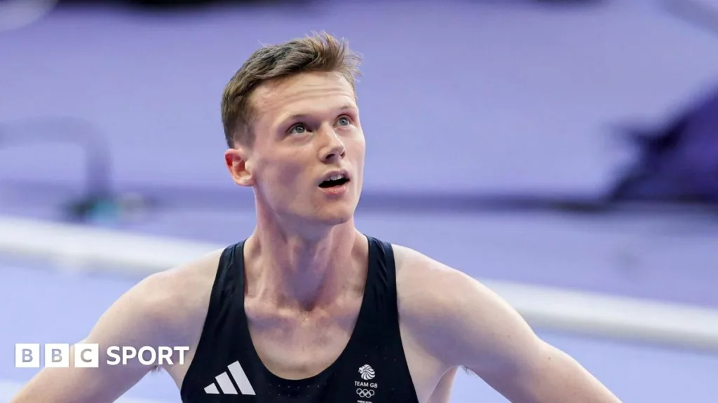 Max Burgin looks up to the big screen following the men's 800m final at Paris 2024