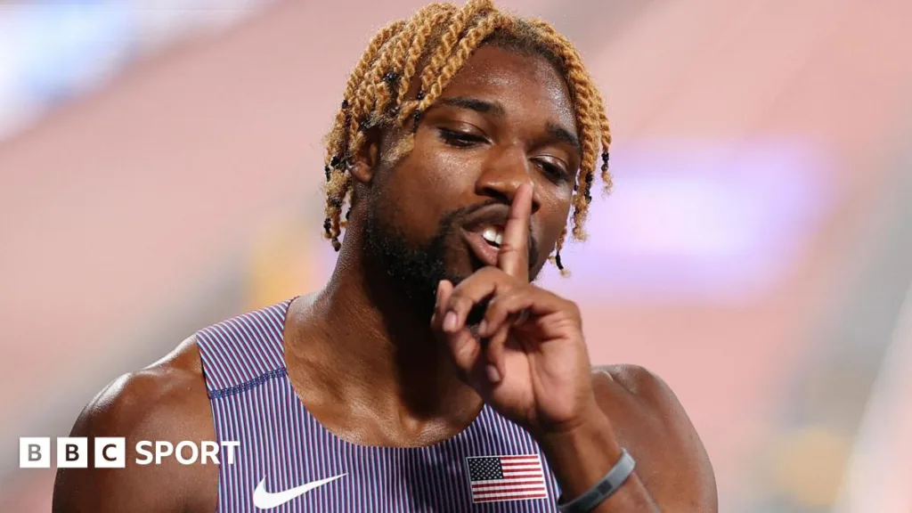 Noah Lyles holds a finger to his mouth after clocking a a world-leading 200m time in the semi-finals