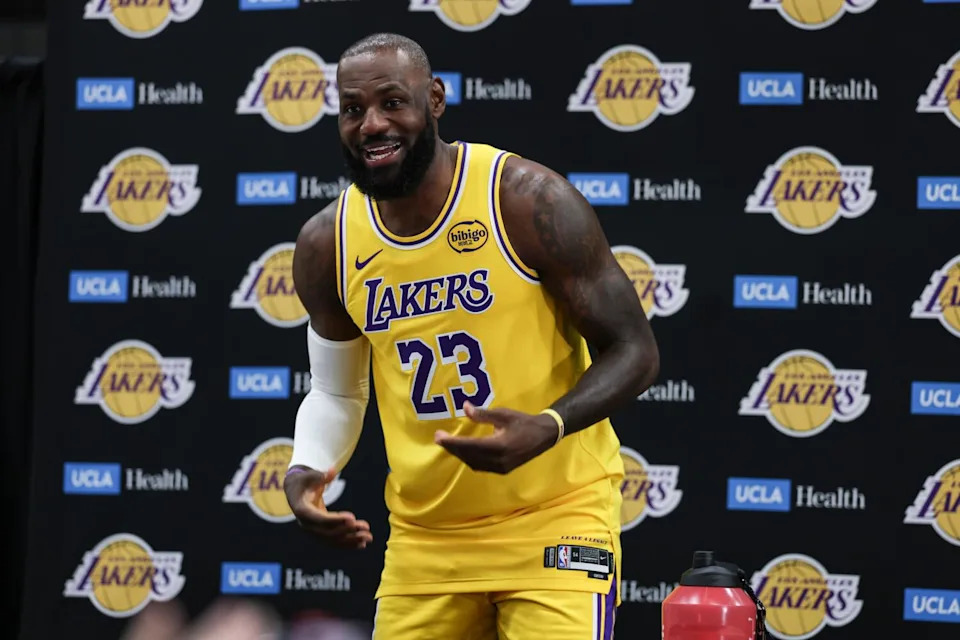 LeBron James jokes with reporters as he arrives for interviews at Lakers media day on Monday.