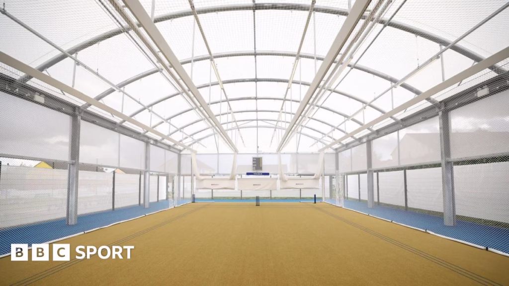 A wide view of a open space called the dome which is used to practice cricket