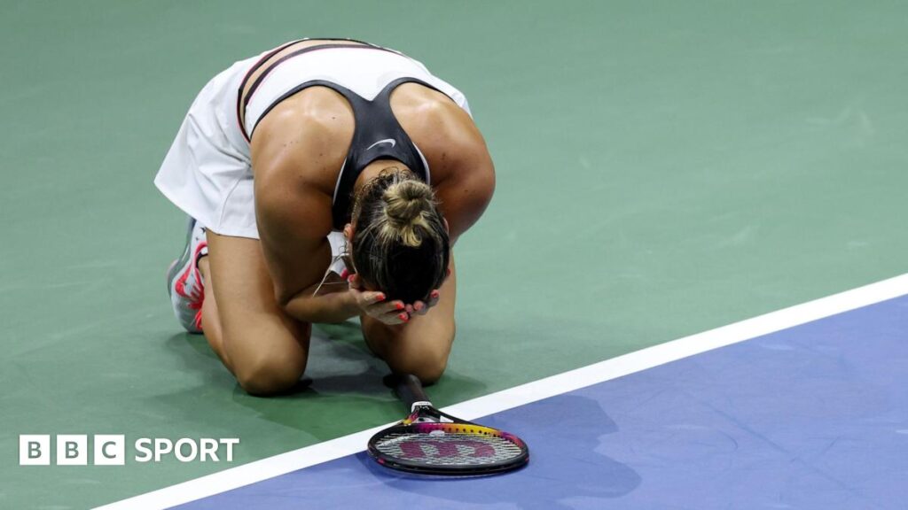 Aryna Sabalenka falls to the court after the 2025 US Open final