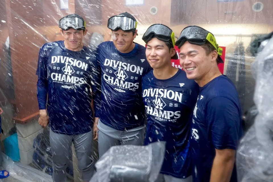 Dodgers Roki Sasaki Shohei Ohtani, Hyeseong Kim and Yoshinobu Yamamoto celebrate after winning their division.