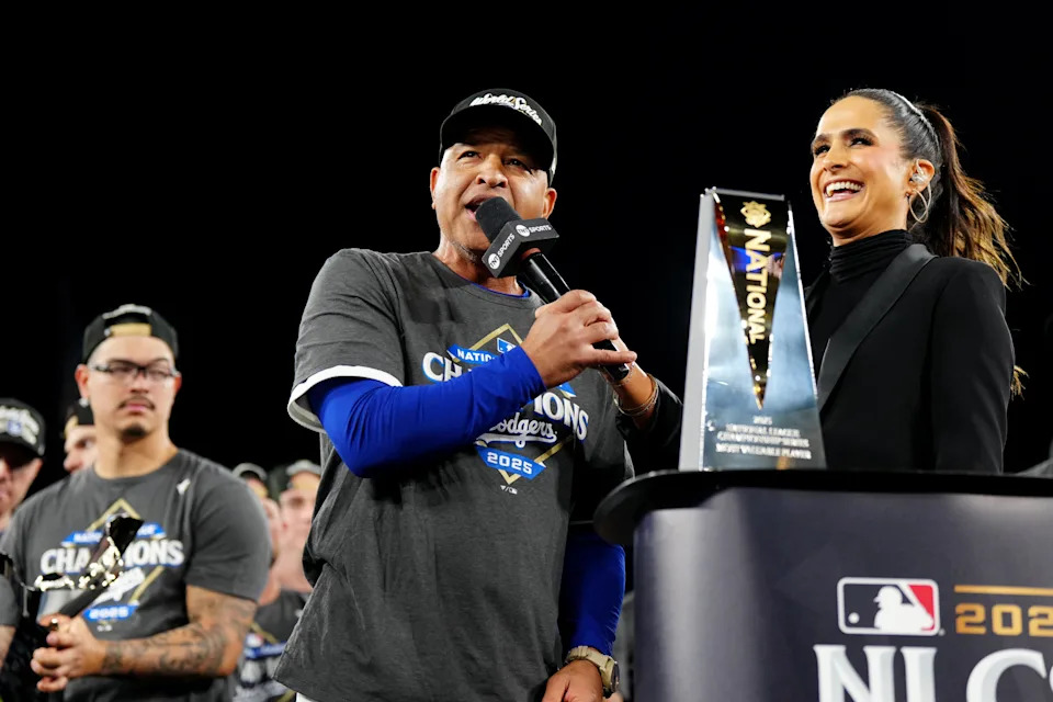 LOS ANGELES, CA - OCTOBER 17:  Manager Dave Roberts #30 of the Los Angeles Dodgers talks with Lauren Shehadi after the Dodgers defeated the Milwaukee Brewers  in Game Four of the National League Championship Series presented by loanDepot to advance to the World Series at Dodger Stadium on Friday, October 17, 2025 in Los Angeles, California. (Photo by Mary DeCicco/MLB Photos via Getty Images)